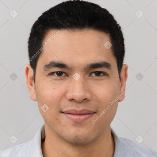 Joyful latino young-adult male with short  black hair and brown eyes