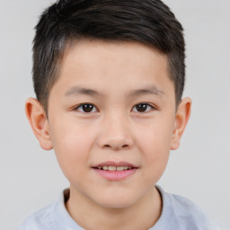 Joyful white child male with short  brown hair and brown eyes