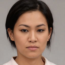 Neutral asian young-adult female with medium  brown hair and brown eyes