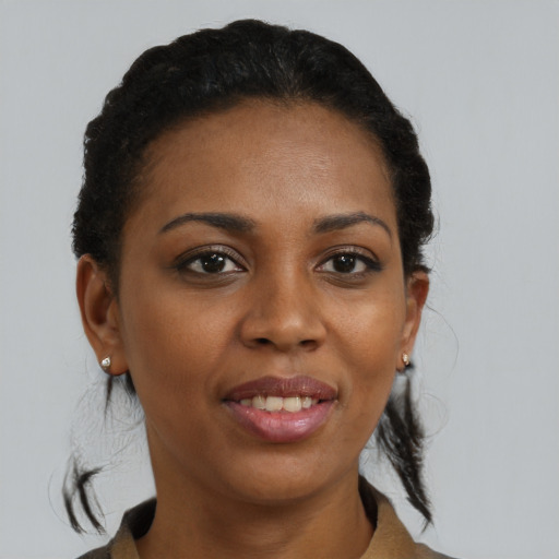 Joyful black young-adult female with short  brown hair and brown eyes