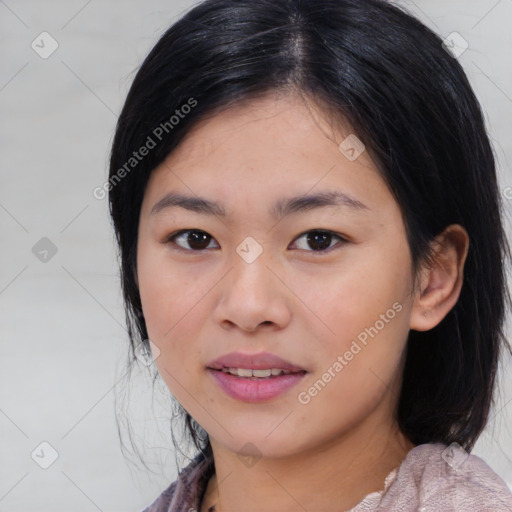 Joyful asian young-adult female with medium  black hair and brown eyes