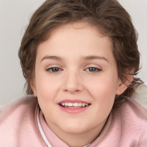 Joyful white child female with medium  brown hair and grey eyes