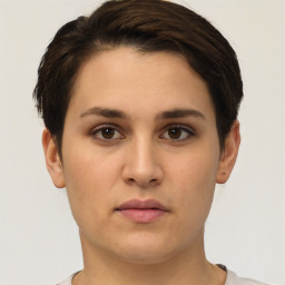 Neutral white young-adult female with short  brown hair and brown eyes