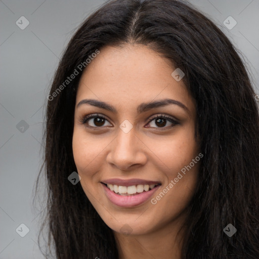 Joyful latino young-adult female with long  brown hair and brown eyes