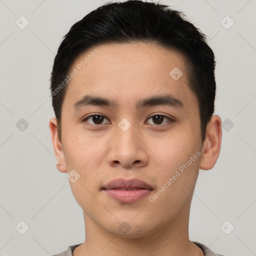 Joyful asian young-adult male with short  black hair and brown eyes