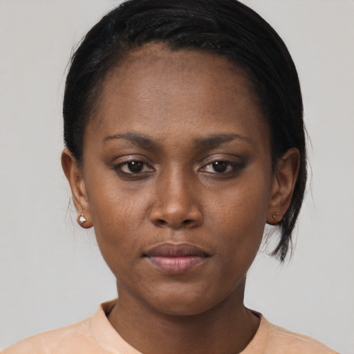 Neutral black young-adult female with medium  black hair and brown eyes
