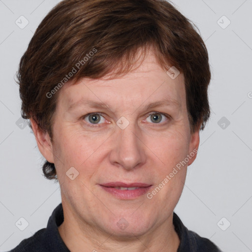 Joyful white adult male with short  brown hair and grey eyes