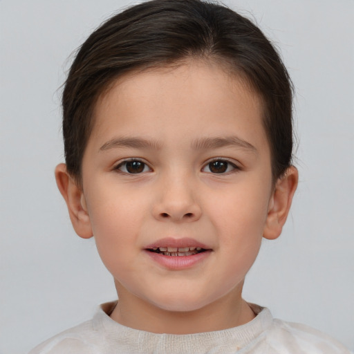 Joyful white child female with short  brown hair and brown eyes