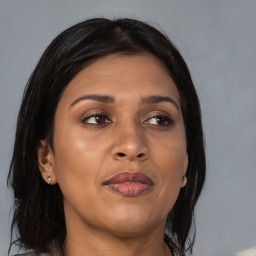 Joyful asian adult female with medium  brown hair and brown eyes