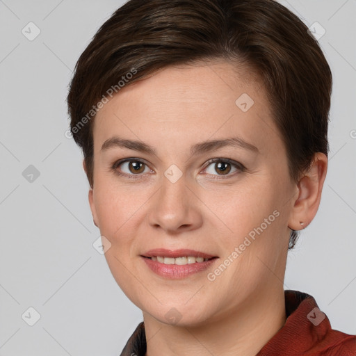 Joyful white young-adult female with short  brown hair and grey eyes