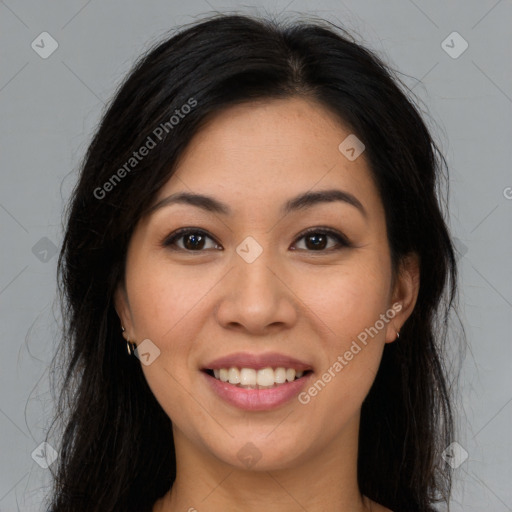 Joyful latino young-adult female with long  brown hair and brown eyes