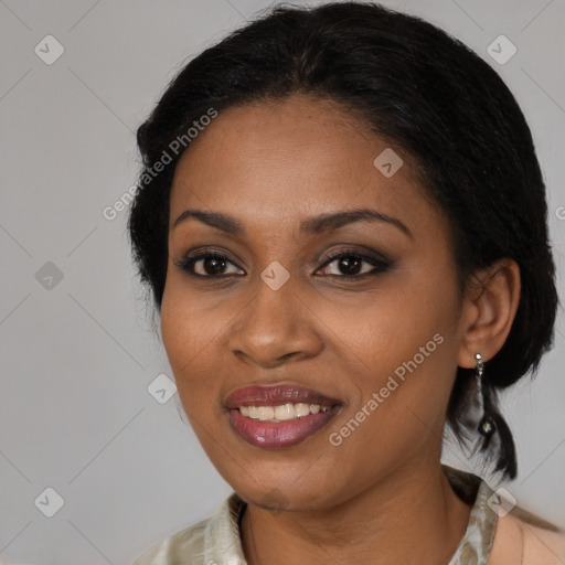 Joyful black adult female with medium  brown hair and brown eyes