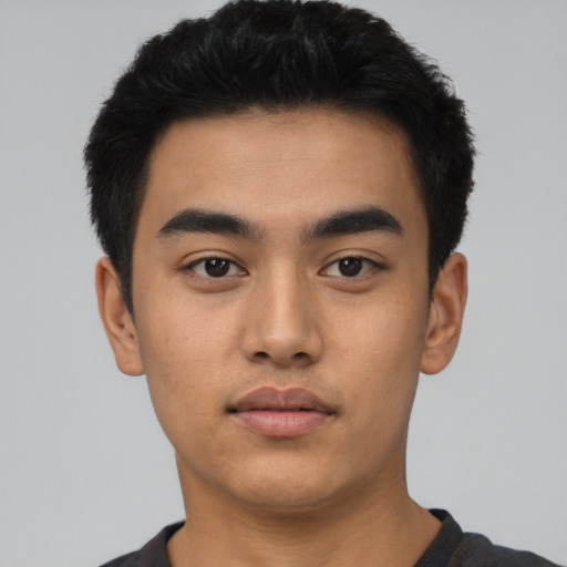 Neutral latino young-adult male with short  black hair and brown eyes
