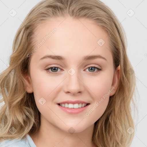 Joyful white young-adult female with long  brown hair and blue eyes