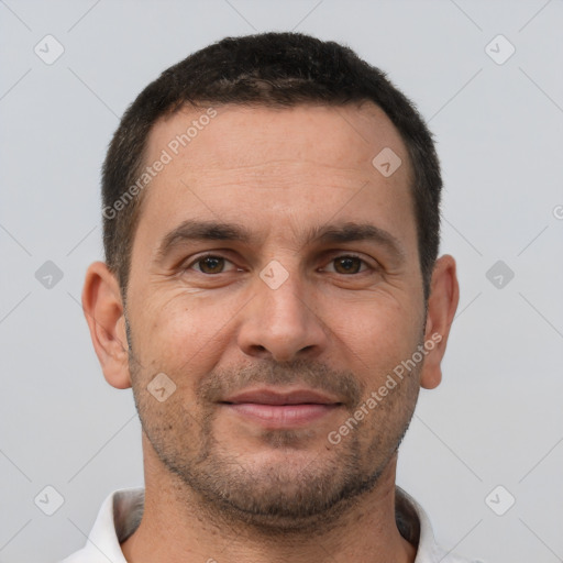 Joyful white adult male with short  brown hair and brown eyes