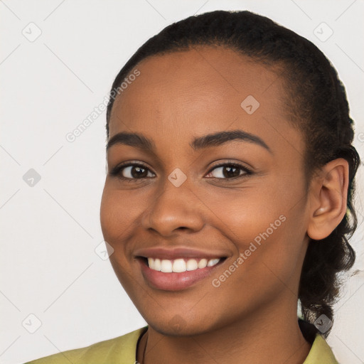 Joyful latino young-adult female with short  brown hair and brown eyes