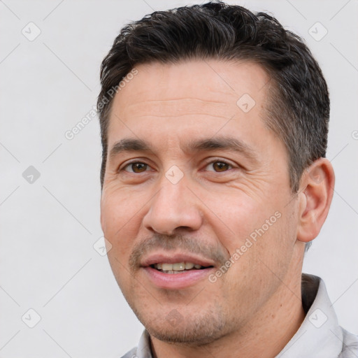 Joyful white adult male with short  brown hair and brown eyes