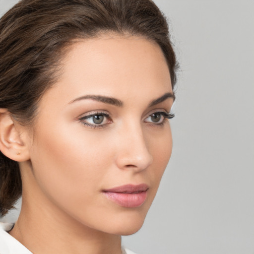 Neutral white young-adult female with medium  brown hair and brown eyes