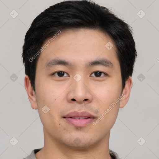 Joyful asian young-adult male with short  brown hair and brown eyes