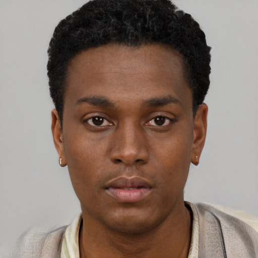 Neutral black young-adult male with short  black hair and brown eyes