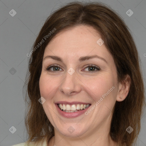 Joyful white adult female with medium  brown hair and brown eyes