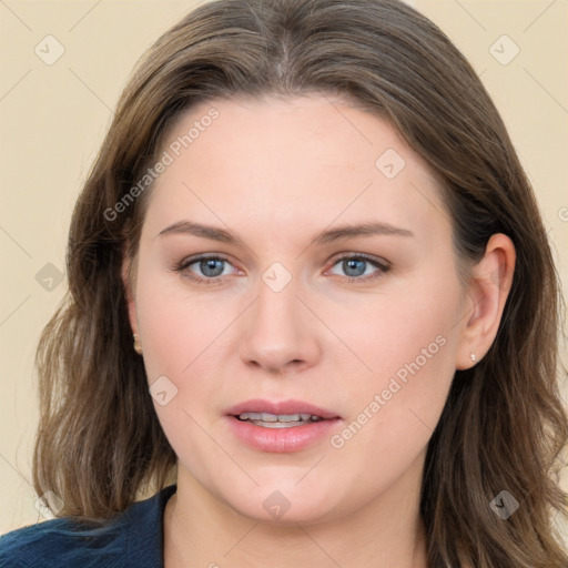 Joyful white young-adult female with long  brown hair and blue eyes