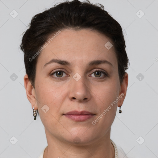 Joyful white adult female with short  brown hair and grey eyes