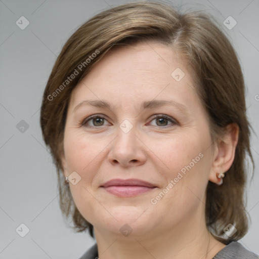 Joyful white adult female with medium  brown hair and grey eyes