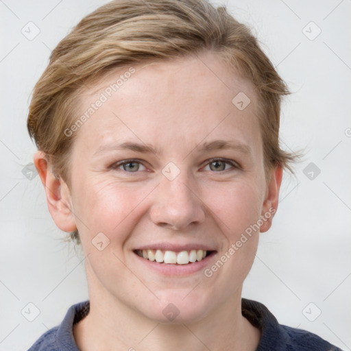 Joyful white young-adult female with medium  brown hair and blue eyes