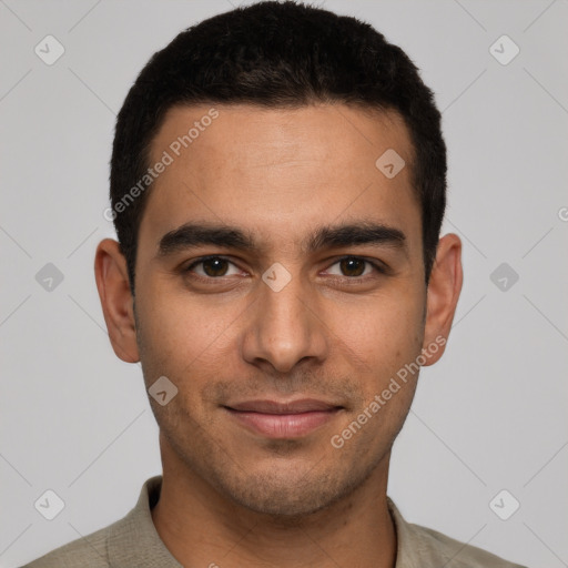 Joyful white young-adult male with short  black hair and brown eyes