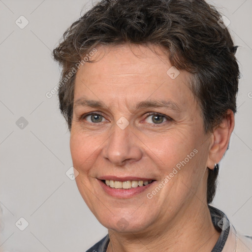 Joyful white adult female with short  brown hair and brown eyes