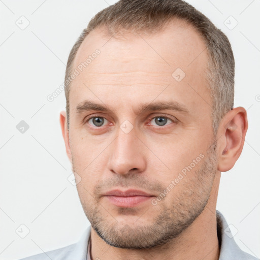 Neutral white young-adult male with short  brown hair and brown eyes