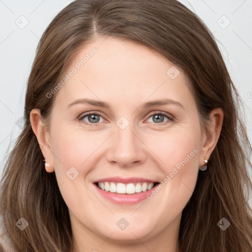 Joyful white young-adult female with long  brown hair and grey eyes