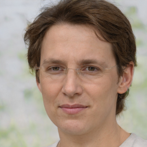 Joyful white adult female with medium  brown hair and green eyes