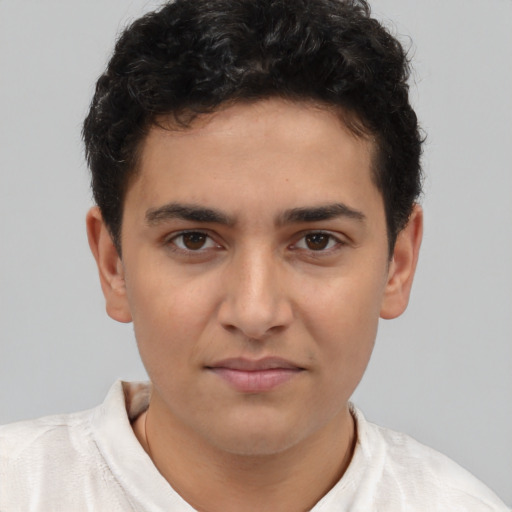 Neutral latino young-adult male with short  brown hair and brown eyes