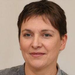 Joyful white adult female with short  brown hair and brown eyes