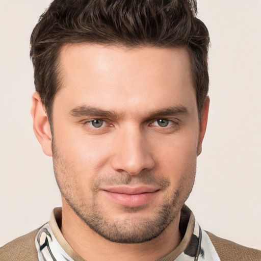 Joyful white young-adult male with short  brown hair and brown eyes