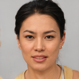 Joyful asian young-adult female with short  brown hair and brown eyes