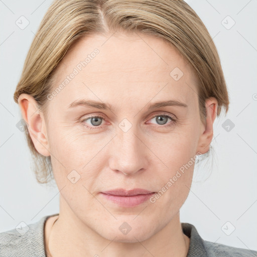 Joyful white adult female with medium  brown hair and blue eyes