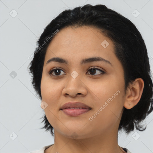 Joyful asian young-adult female with medium  black hair and brown eyes