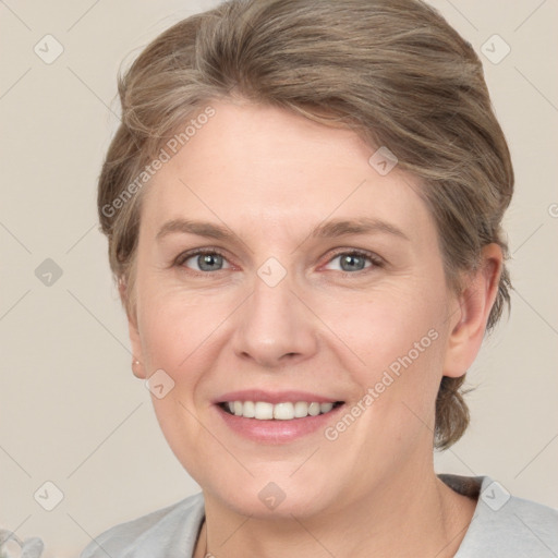 Joyful white adult female with short  brown hair and grey eyes