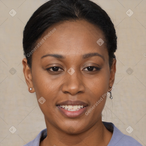 Joyful black young-adult female with short  black hair and brown eyes