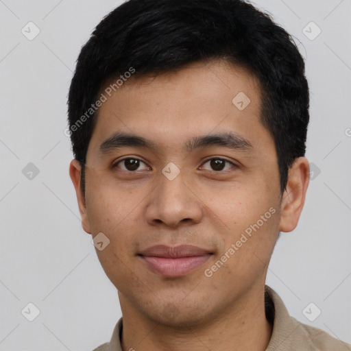 Joyful latino young-adult male with short  black hair and brown eyes