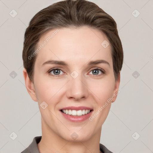 Joyful white young-adult female with short  brown hair and grey eyes