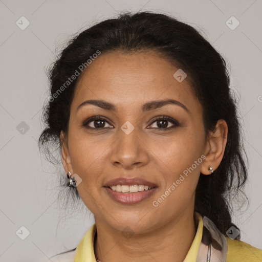 Joyful latino adult female with medium  brown hair and brown eyes