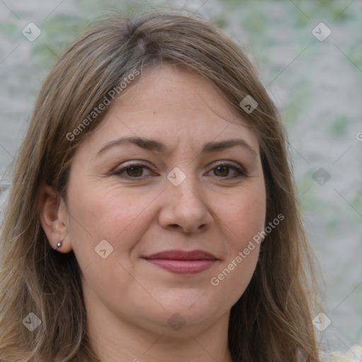 Joyful white adult female with long  brown hair and brown eyes