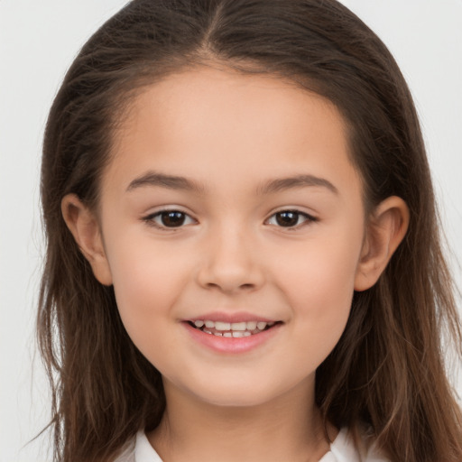 Joyful white child female with long  brown hair and brown eyes