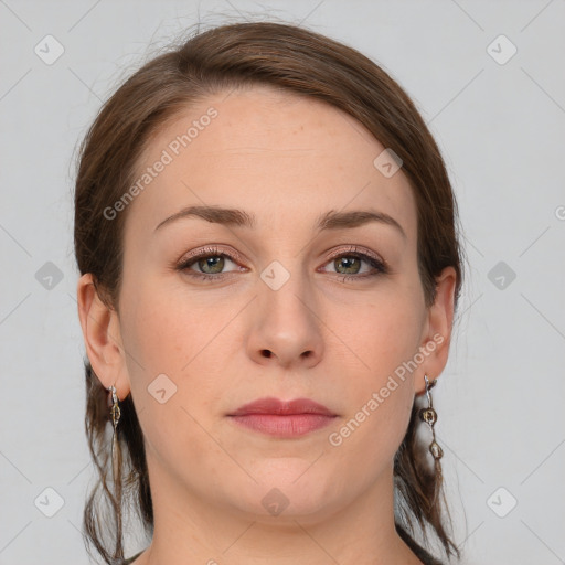 Joyful white young-adult female with medium  brown hair and green eyes