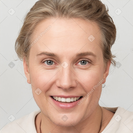 Joyful white young-adult female with medium  brown hair and blue eyes