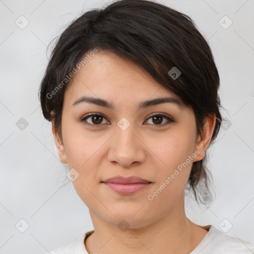 Joyful latino young-adult female with medium  brown hair and brown eyes